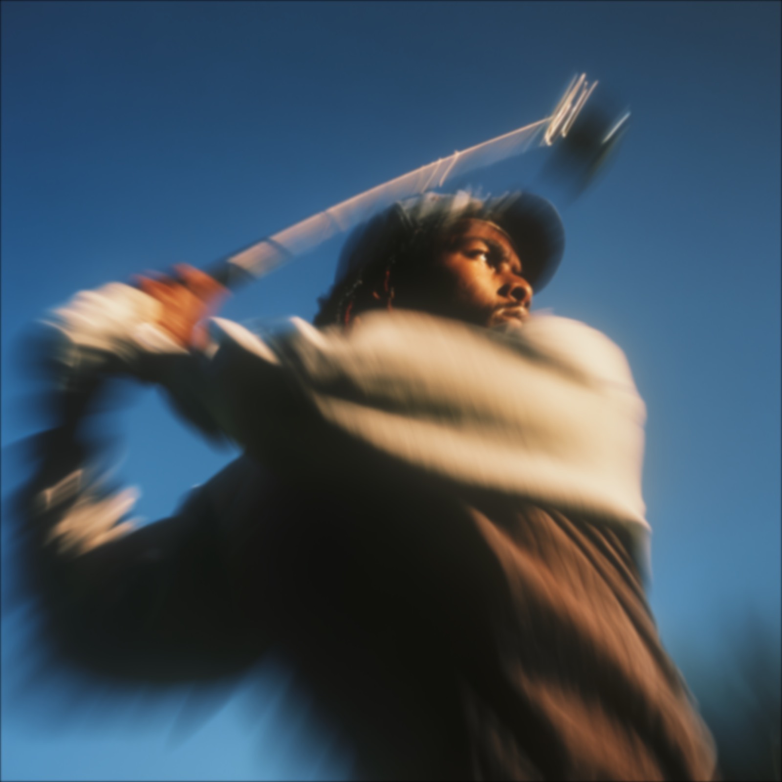 Original action portrait against a blue sky